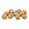 Truffes blanches fraîches Tuber magnatum de taille moyenne, à la surface ocre pâle et aux formes naturellement variables