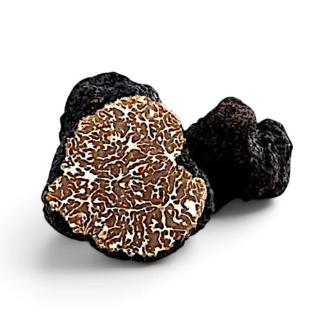 Truffes Tuber mesentericum Bagnoli entières et coupées, présentant l’extérieur sombre et l’intérieur marbré