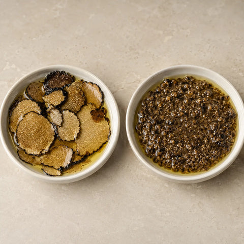 Side-by-side comparison of Summer Truffle Carpaccio in Olive Oil and Minced Summer Truffle in Olive Oil in two white dishes