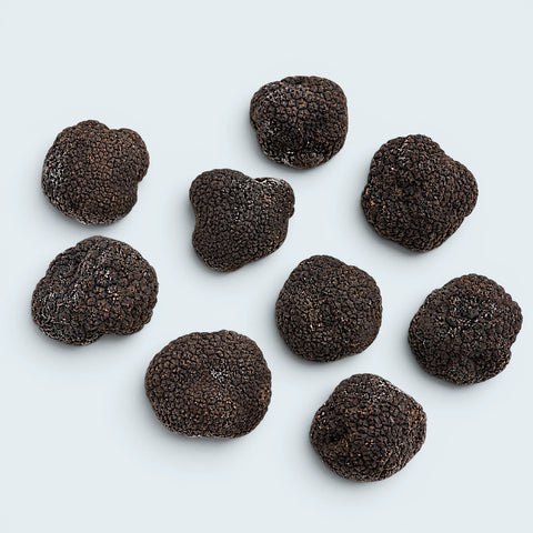 Truffes noires entières surgelées individuellement, avec une légère couche de givre naturel