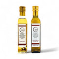 Deux bouteilles d’huile d’olive Terra Ross aromatisée à la truffe noire et blanche
