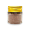Poudre de paillettes dorées dans un pot transparent avec un couvercle jaune pour Poudre de Truffe Tuber Brumale