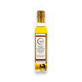 Bouteille d'huile d'olive extra vierge à la truffe blanche avec bouchon et étiquette dorés pour la cuisine gastronomique